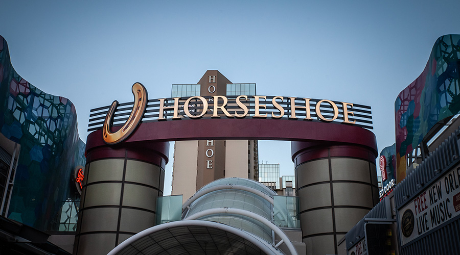 LAS VEGAS, AUGUST 21, 2024: Wide arch and golden horseshoe logo mark the new front entrance of Horseshoe Las Vegas, the rebranded former Bally’s property on the central Strip.