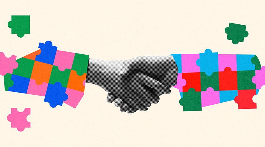 Collage-style artwork. Two arms extending into a handshake, both made from multi-colored puzzle pieces, against a neutral background. Concept of business partnership, collaboration and unity. Banner