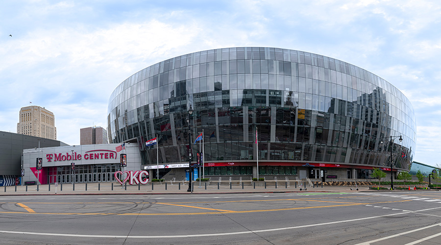 Kansas City, MO USA - April 14th 2025: Wide panoramic shot of the T Mobile Center in downtown KC.  Large round glass arena with striking exterior appearance.  Main entrance side.